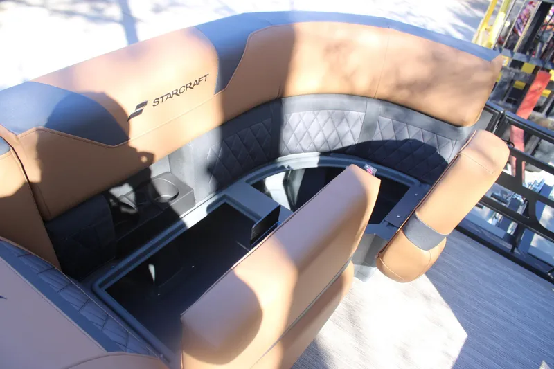 Slide: The Image of Luxurious seating in 2026 Starcraft SLS 3 RL boat, featuring tan and black upholstery. - 28