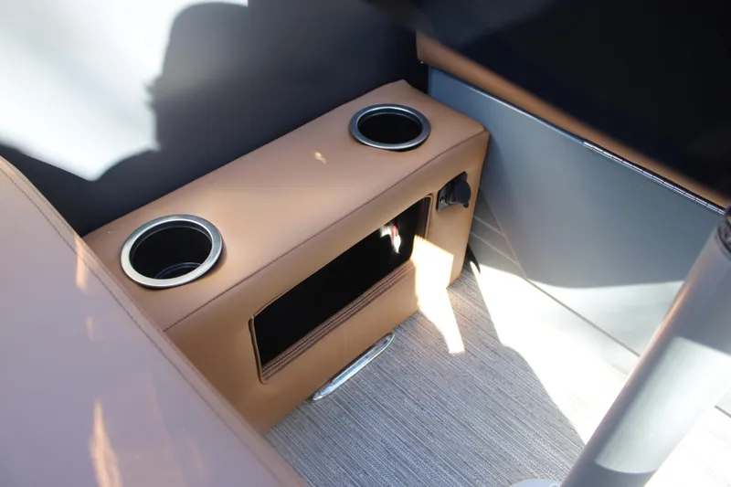 Slide: The Image of 2026 Starcraft SLS 3 RL interior with cup holders and storage compartment. - 30