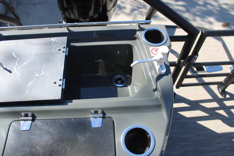 Slide: The Image of 2026 Starcraft SLS 3 RL boat sink and cup holders on deck. - 8