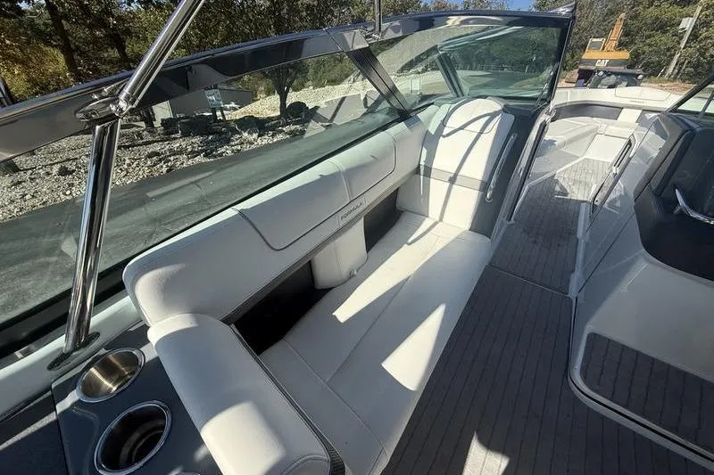 Slide: The Image of 2015 Formula 350 Crossover Bowrider interior with white seating and sleek design. - 12