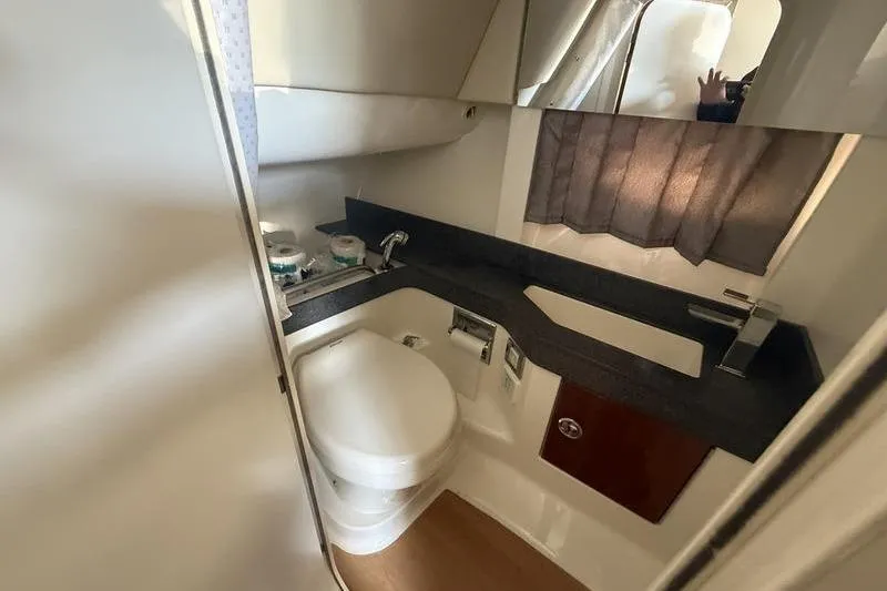 Slide: The Image of 2015 Formula 350 Crossover Bowrider bathroom with modern fixtures and compact design. - 17