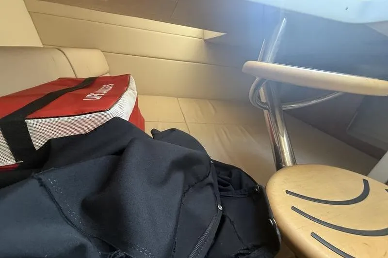 Slide: The Image of Interior of 2015 Formula 350 Crossover Bowrider with life vest and seating area. - 18