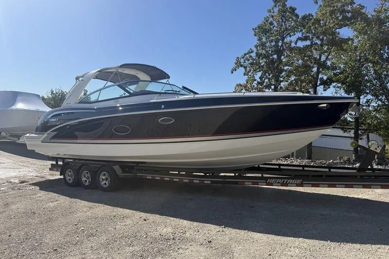 Slide: The Image of 2015 Formula 350 Crossover Bowrider on trailer, parked outdoors. - 6