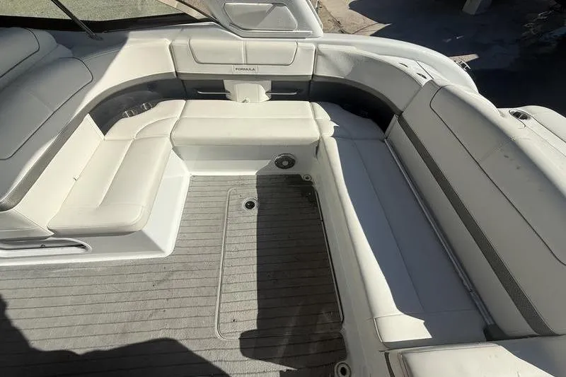 Slide: The Image of 2015 Formula 350 Crossover Bowrider interior with spacious seating and sleek design. - 7