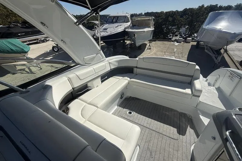 Slide: The Image of 2015 Formula 350 Crossover Bowrider interior with spacious seating and sleek design. - 9