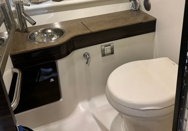 Slide: The Image of Interior of a 2015 Formula 310 Sun Sport boat with leather seating. - 12