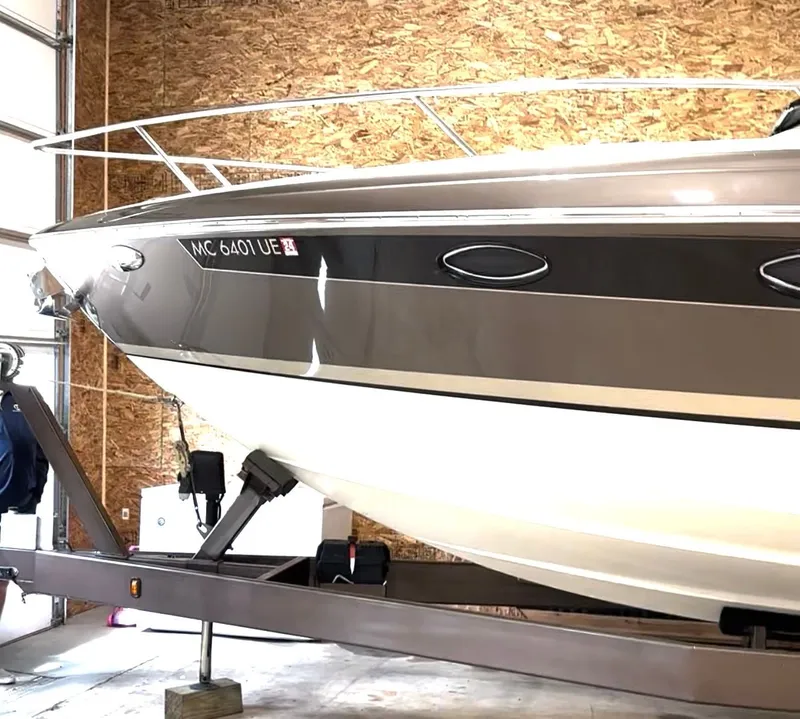 Slide: The Image of 2015 Formula 310 Sun Sport interior with beige seating and carpeted flooring. - 5