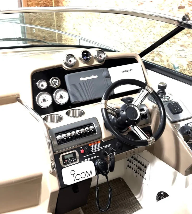 Slide: The Image of 2015 Formula 310 Sun Sport boat interior with custom dog graphic and beige seating. - 6