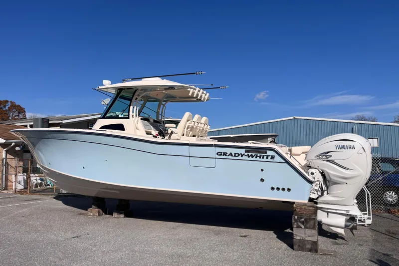 The Image of 2022 Grady-White Canyon 336 boat with Yamaha engines on display outdoors. - 1