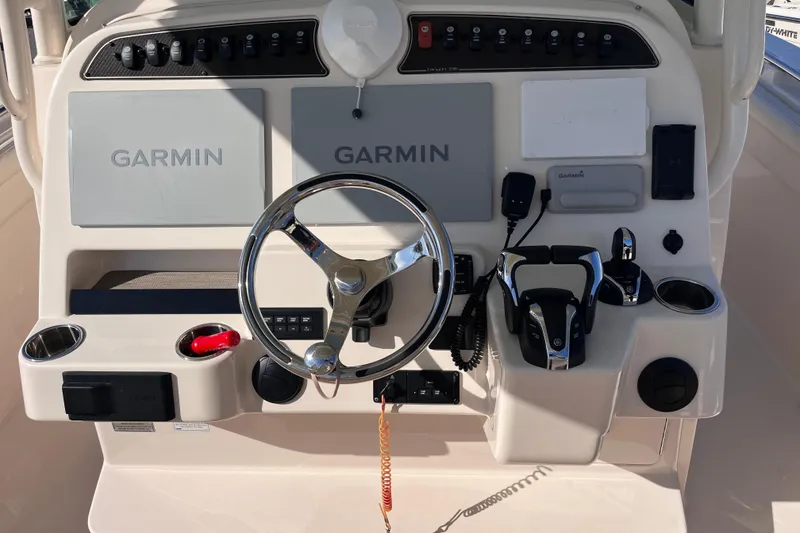 Slide: The Image of Control panel of 2022 Grady-White Canyon 336 boat with Garmin navigation systems. - 5