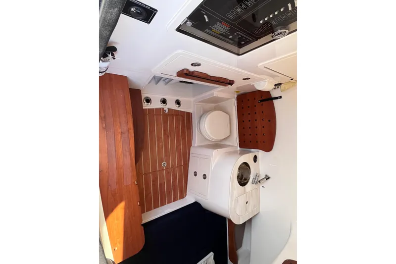 Slide: The Image of 2022 Grady-White Canyon 336 cabin interior with wood accents and modern amenities. - 9