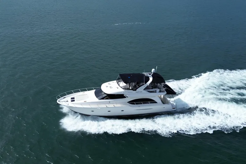Slide: The Image of 2005 Meridian 580 Pilothouse yacht cruising on open water. - 1
