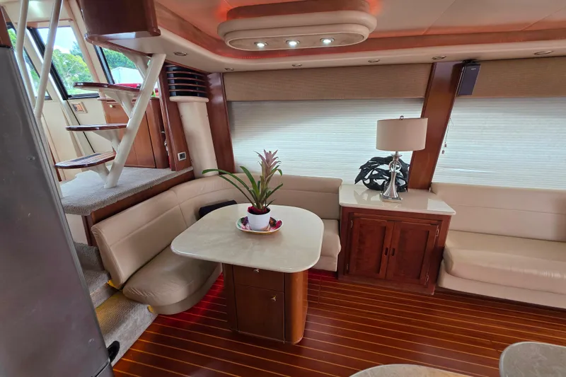 Slide: The Image of Luxurious 2005 Meridian 580 Pilothouse yacht interior with bar and TV setup. - 12