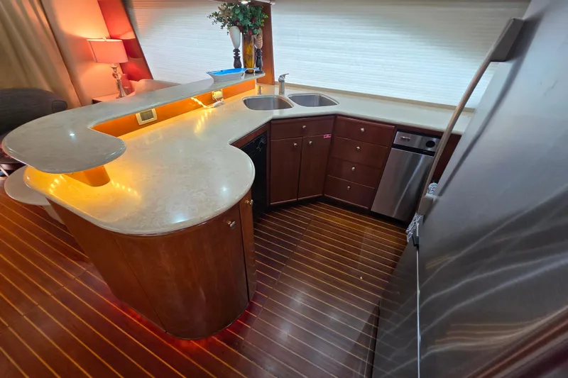 Slide: The Image of Luxurious 2005 Meridian 580 Pilothouse interior with modern kitchen and elegant wood finishes. - 14