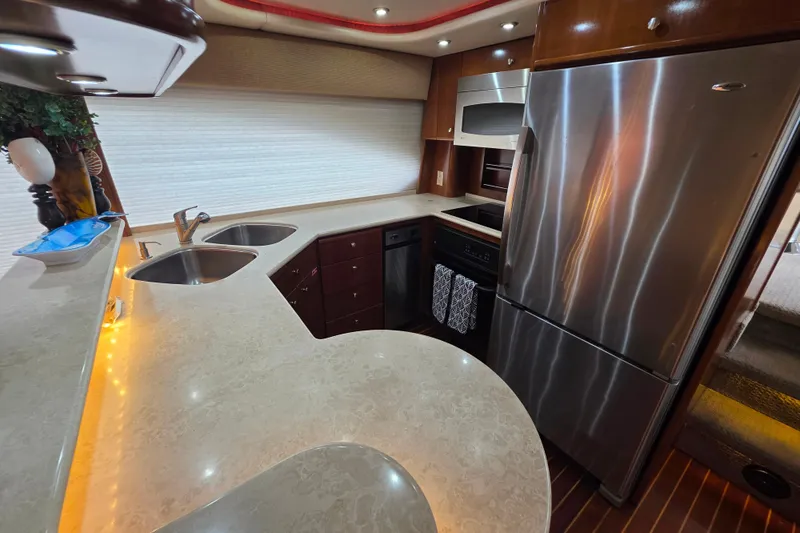 Slide: The Image of Luxurious kitchen interior of 2005 Meridian 580 Pilothouse yacht with modern amenities. - 15