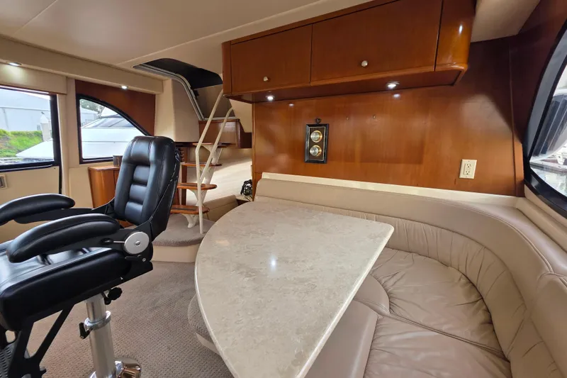 Slide: The Image of Luxurious interior of 2005 Meridian 580 Pilothouse with helm, seating, and elegant wood finishes. - 19