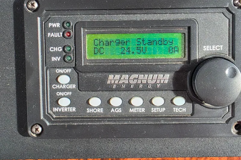 Slide: The Image of Pilothouse of 2005 Meridian 580, featuring navigation instruments and wooden accents. - 22