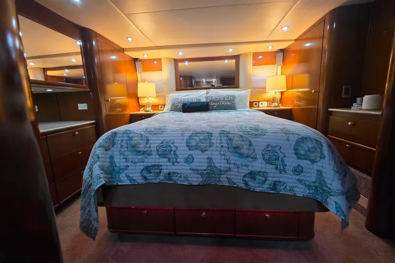 Slide: The Image of Luxurious bedroom in 2005 Meridian 580 Pilothouse yacht with elegant wood finishes. - 27