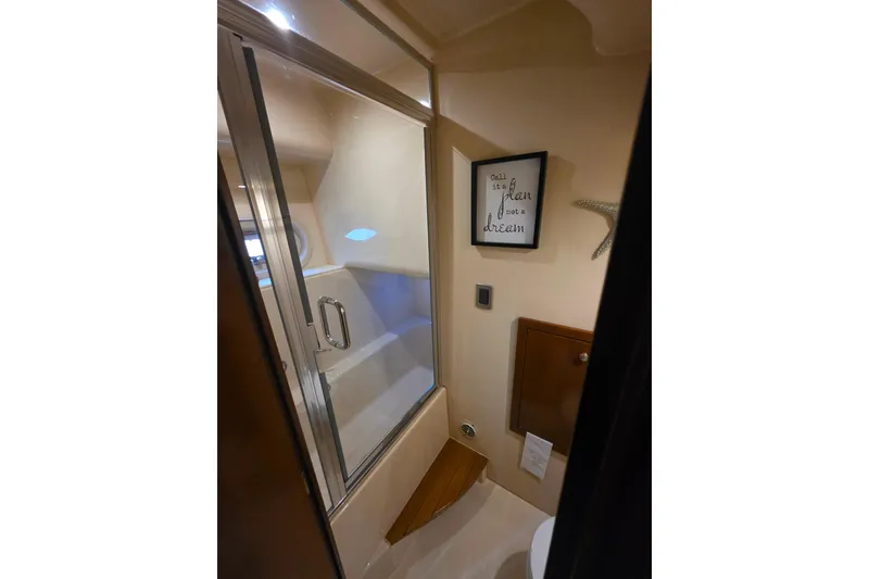 Slide: The Image of Luxurious bedroom interior of 2005 Meridian 580 Pilothouse yacht with elegant decor. - 28