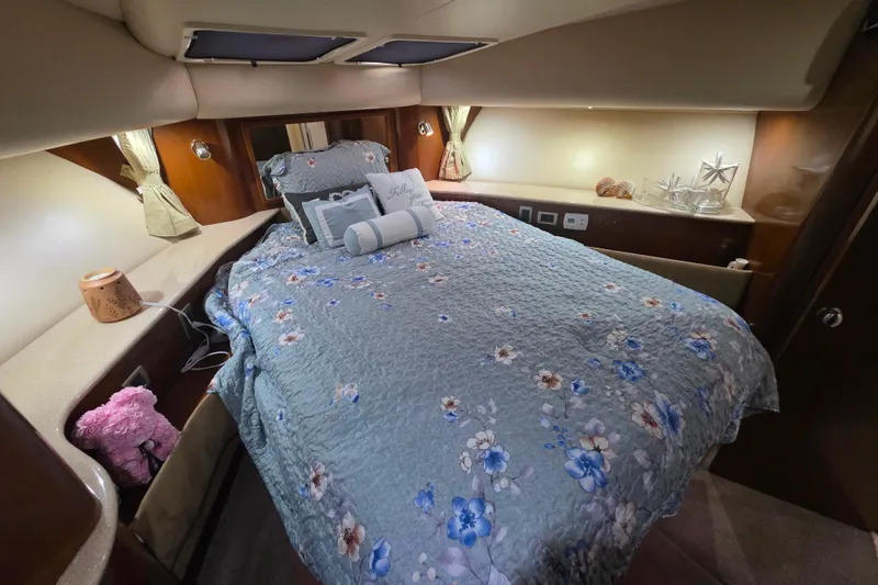 Slide: The Image of Luxurious bedroom interior of 2005 Meridian 580 Pilothouse yacht with floral bedding. - 34