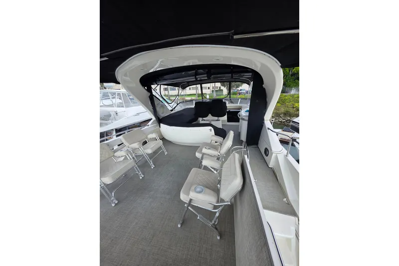 Slide: The Image of 2005 Meridian 580 Pilothouse interior with covered seats and life preserver. - 46