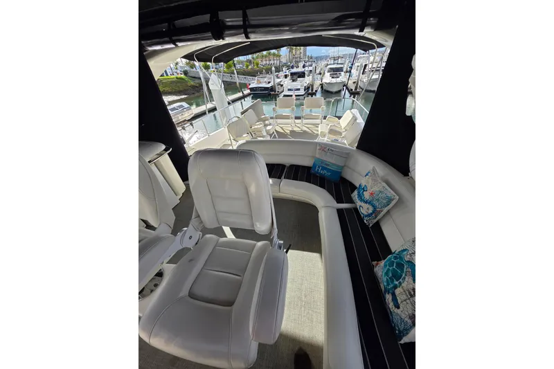 Slide: The Image of 2005 Meridian 580 Pilothouse yacht interior with seating and helm station. - 47