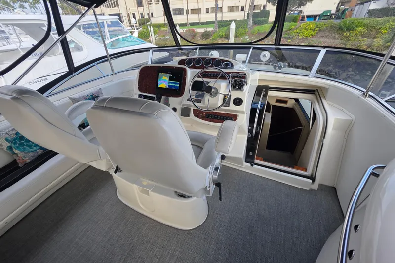 Slide: The Image of Luxurious 2005 Meridian 580 Pilothouse yacht interior with plush seating and marina view. - 51