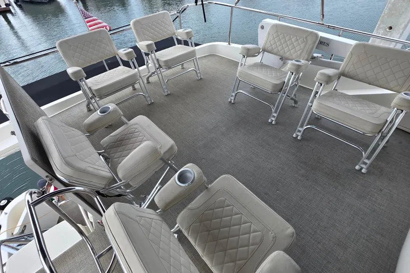 Slide: The Image of 2005 Meridian 580 Pilothouse yacht interior with seating and helm station. - 67