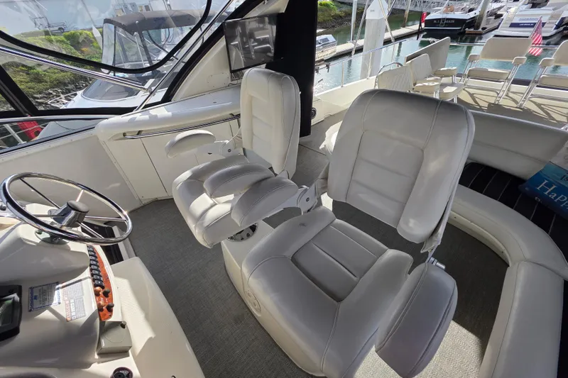 Slide: The Image of 2005 Meridian 580 Pilothouse interior with TV, counter, and mini fridge. - 69