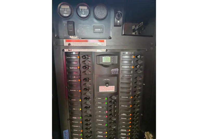 Slide: The Image of Pilothouse interior of 2005 Meridian 580, featuring helm, seating, and navigation equipment. - 71