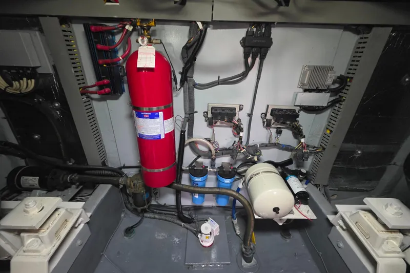 Slide: The Image of Engine room of 2005 Meridian 580 Pilothouse with visible filters and components. - 79