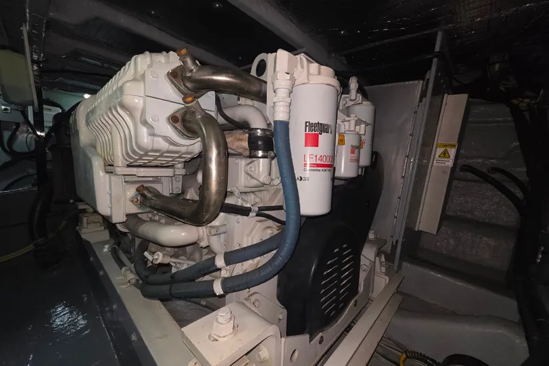 Slide: The Image of Engine room of 2005 Meridian 580 Pilothouse with fire extinguisher and mechanical components. - 80