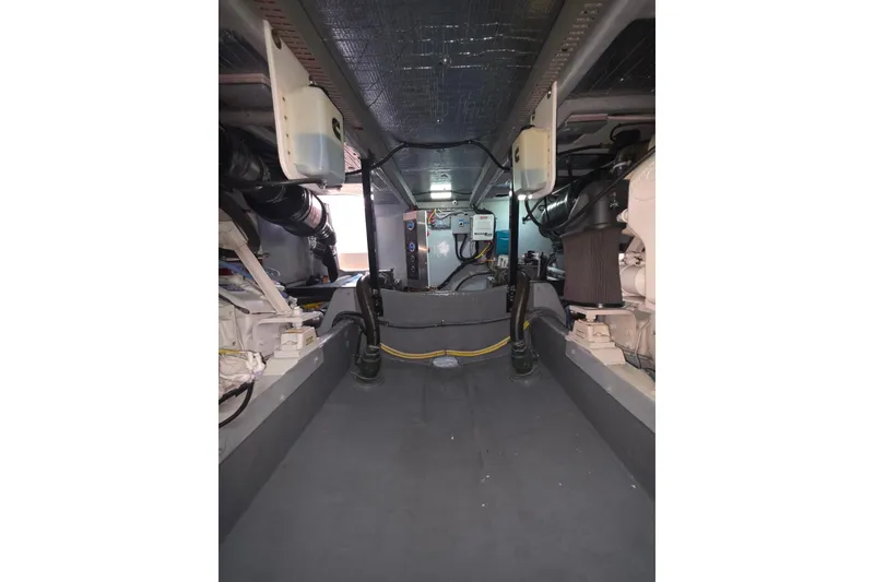 Slide: The Image of Engine room of 2005 Meridian 580 Pilothouse with visible filters and components. - 82