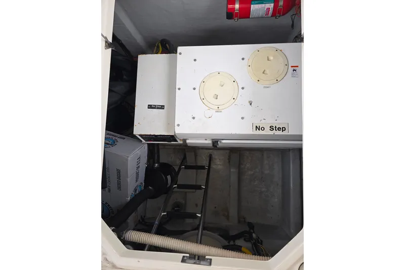 Slide: The Image of Engine room of 2005 Meridian 580 Pilothouse yacht, showcasing mechanical components. - 83