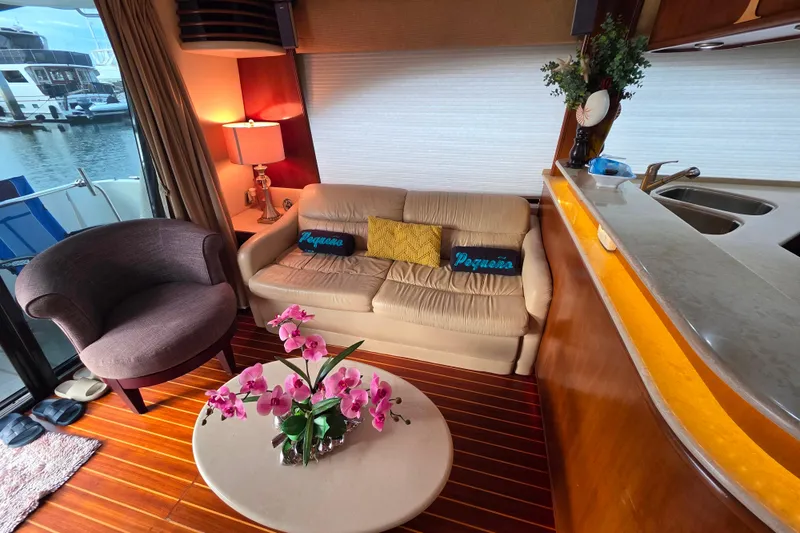 Slide: The Image of Luxurious interior of a 2005 Meridian 580 Pilothouse yacht with elegant wood finishes. - 9
