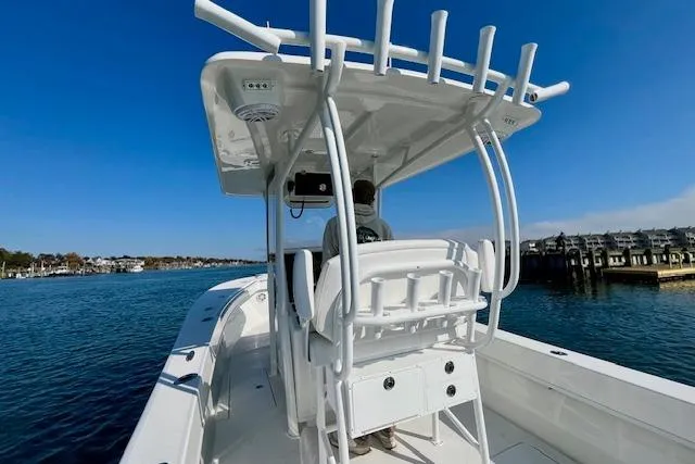 Slide: The Image of 2026 Pair Customs 28 Center Console boat on calm water, clear blue sky. - 10