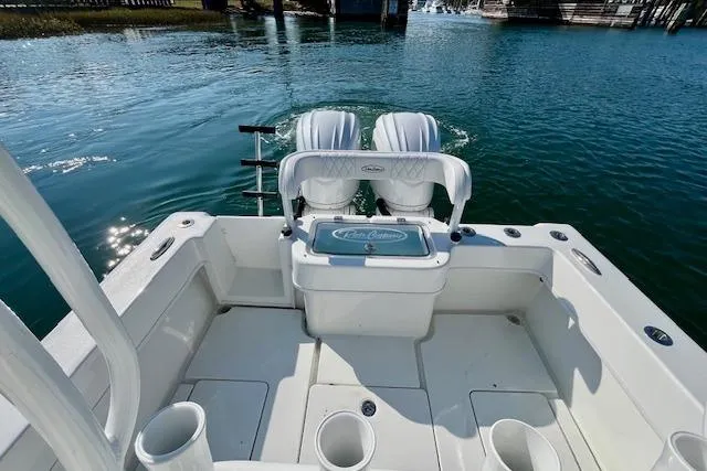 Slide: The Image of 2026 Pair Customs 28 Center Console boat with dual engines on calm water. - 11