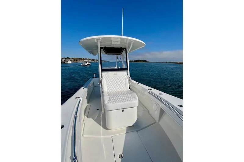 Slide: The Image of 2026 Pair Customs 28 Center Console boat on calm water, featuring sleek design and spacious seating. - 4