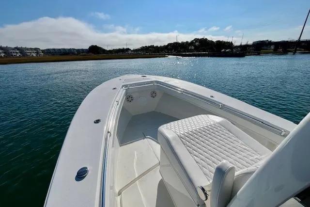 Slide: The Image of 2026 Pair Customs 28 Center Console boat on calm water, featuring sleek design and comfortable seating. - 5