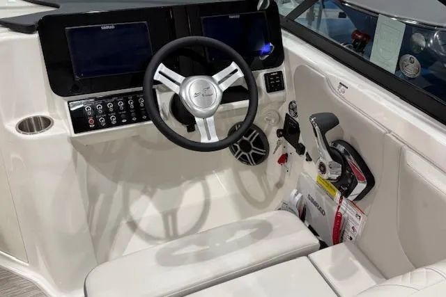 Slide: The Image of 2026 Sea Ray SDX 230 boat interior with spacious seating and modern design. - 10