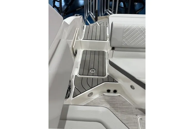 Slide: The Image of 2026 Sea Ray SDX 230 boat interior with modern seating and dashboard. - 13