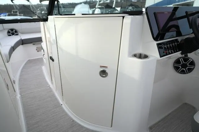 Slide: The Image of 2026 Sea Ray SDX 230 boat interior with sleek design and modern control panel. - 16