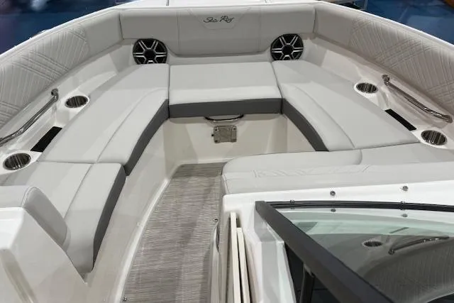 Slide: The Image of 2026 Sea Ray SDX 230 boat, rear view, parked on trailer, outdoor setting. - 6