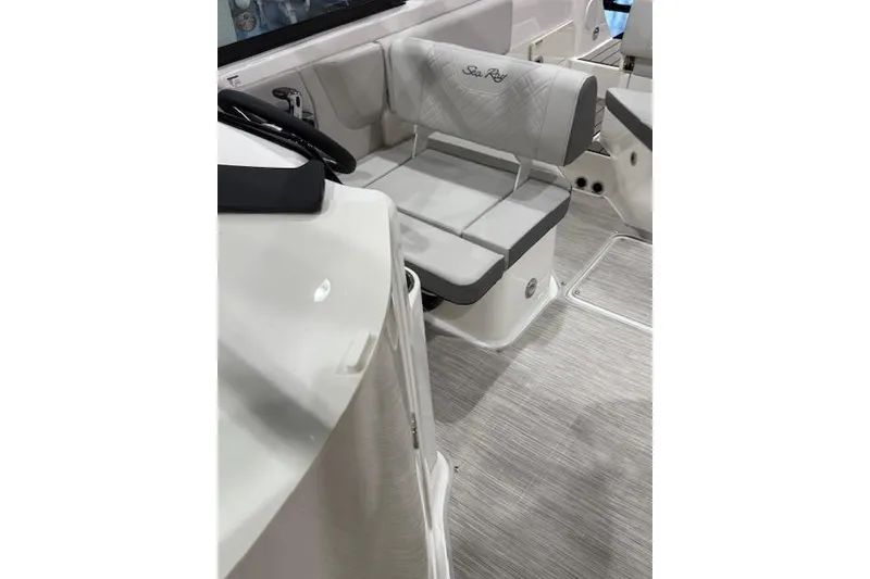 Slide: The Image of 2026 Sea Ray SDX 230 boat with spacious, luxurious seating and sleek design. - 8
