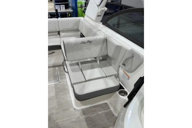 Slide: The Image of 2026 Sea Ray SDX 230 boat interior with spacious seating and modern dashboard. - 9