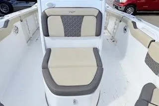 Slide: The Image of 2021 Tidewater 272 CC Adventure boat interior with cushioned seating. - 17