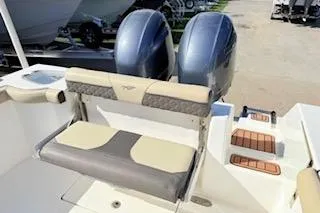 Slide: The Image of 2021 Tidewater 272 CC Adventure boat with dual engines and cushioned seating. - 8