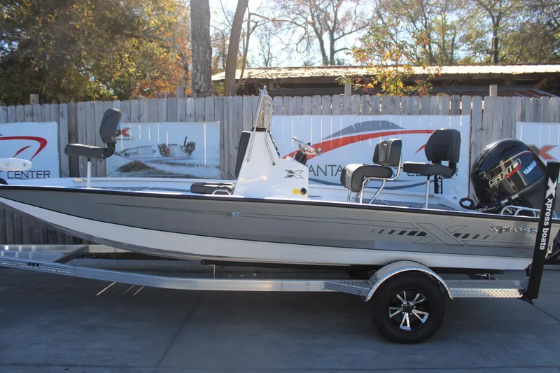 The Image of 2026 Xpress H20B Bay boat on trailer, featuring sleek design and Yamaha engine. - 1