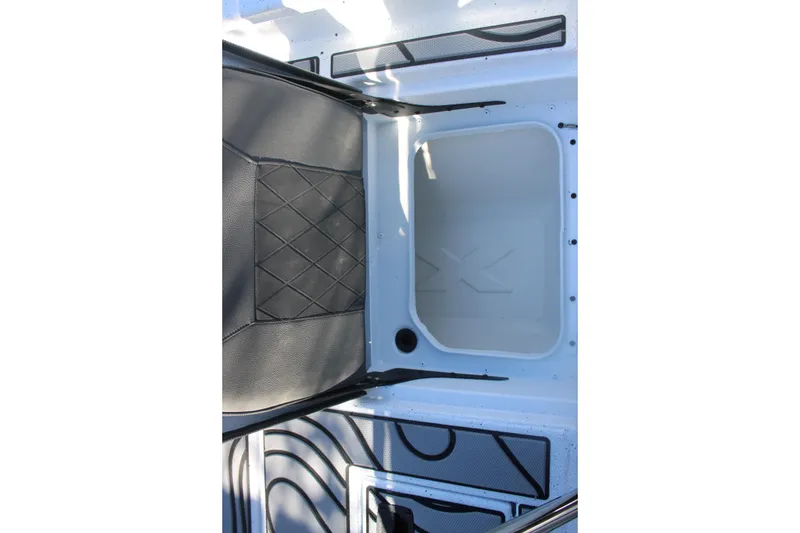 Slide: The Image of Interior view of 2026 Xpress H20B Bay boat, featuring seating and storage area. - 10