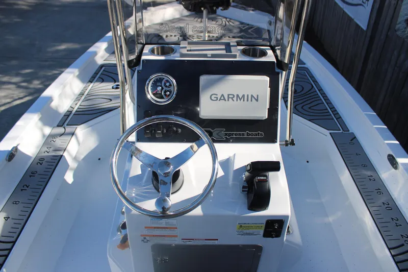 Slide: The Image of 2026 Xpress H20B Bay boat dashboard with Garmin navigation system. - 11